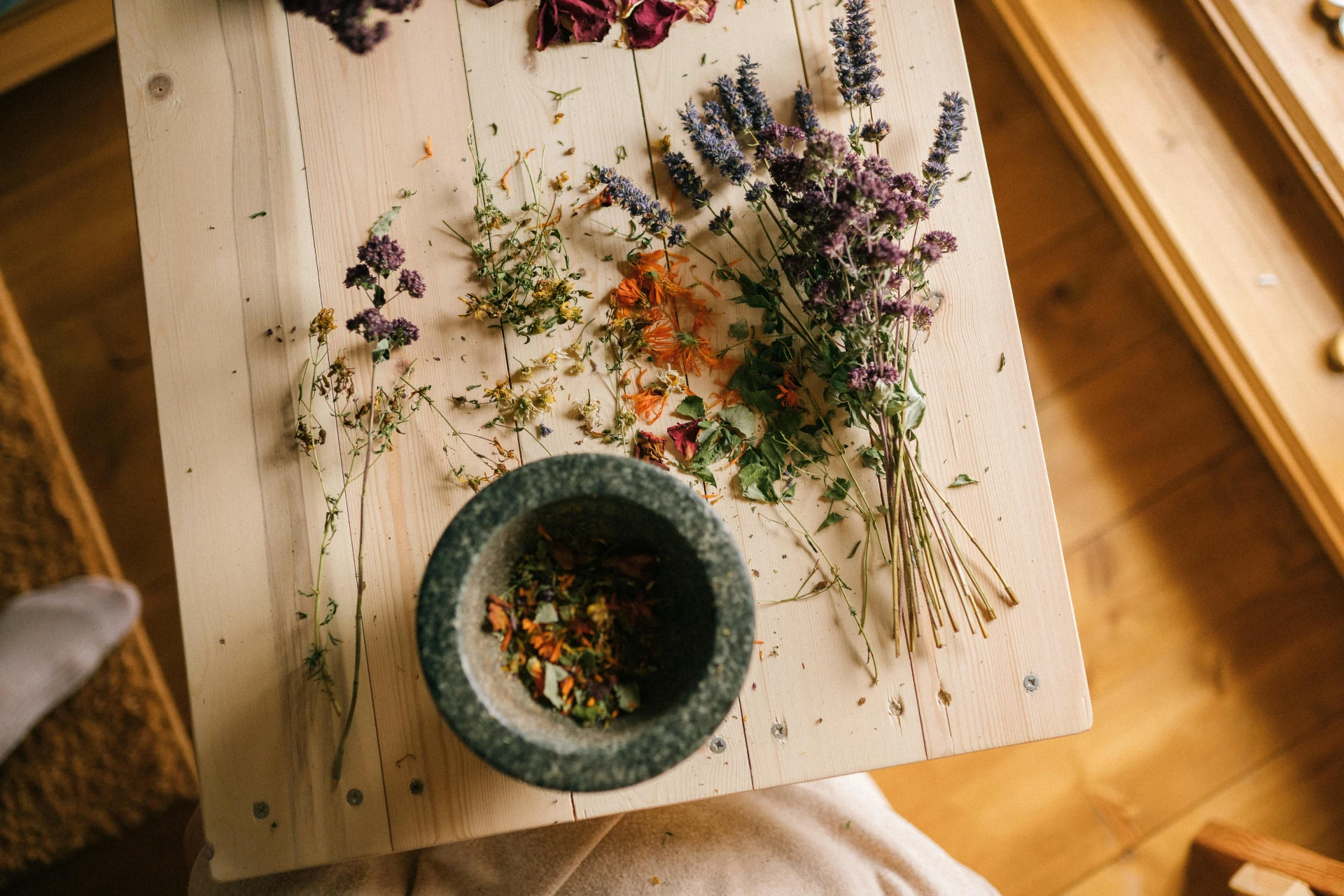 herbs on a wooden board with a mortal and pestle: Herbs for Sleep Apnea