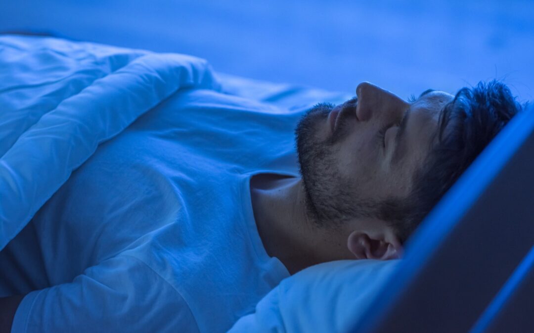 man in his bed sleeping