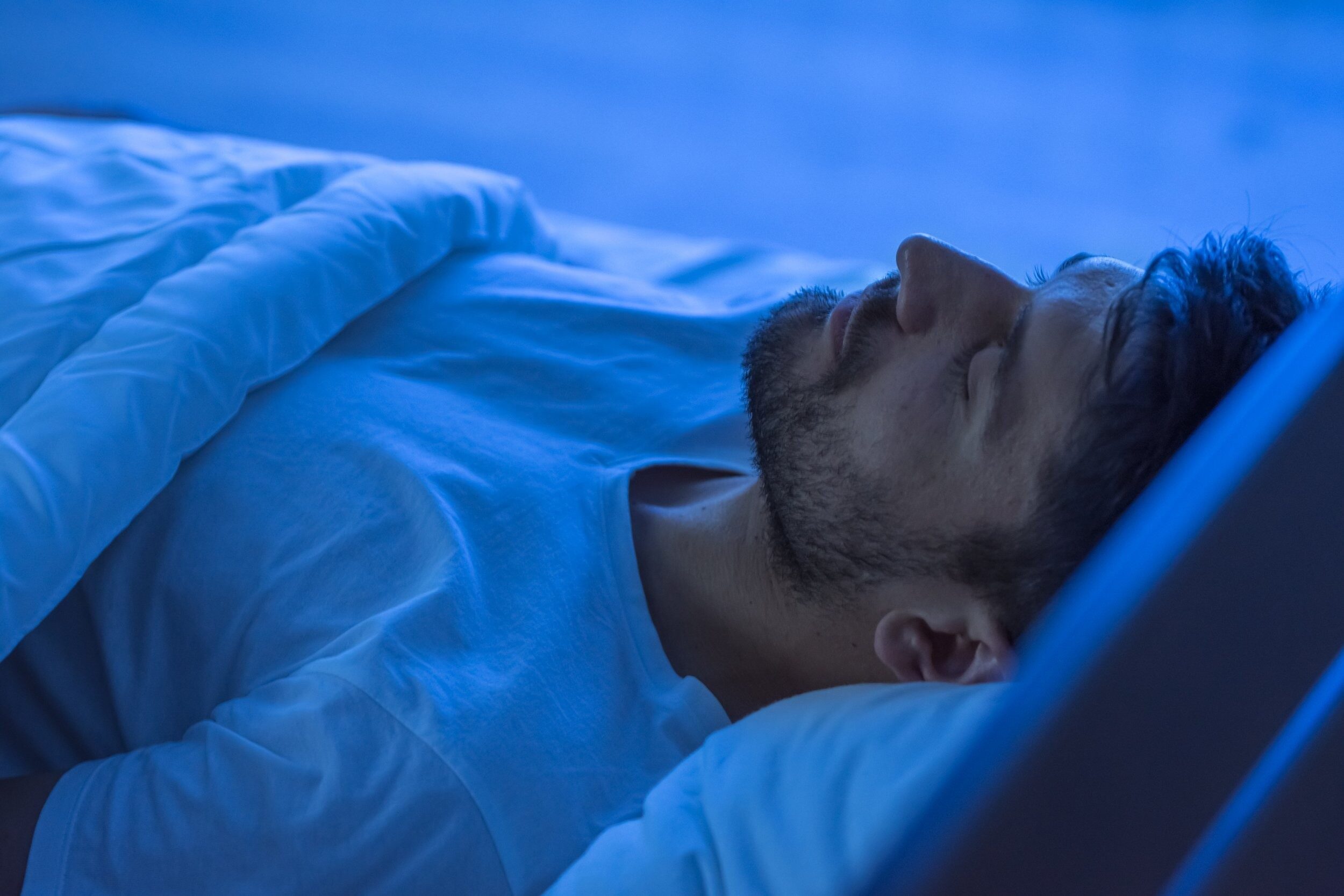 man in his bed sleeping