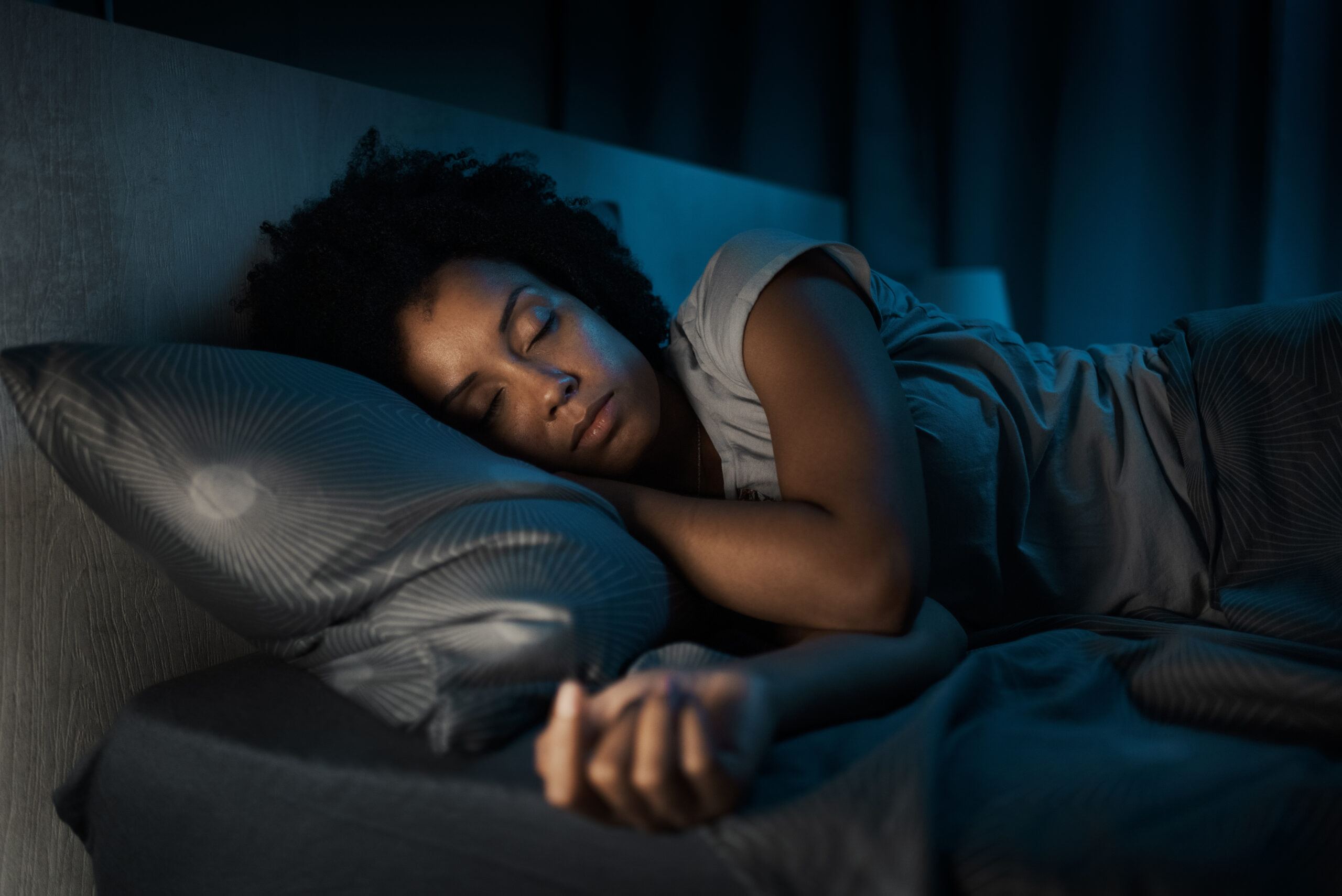 African american woman sleeping in her bed woman sleeping soundly in her bed